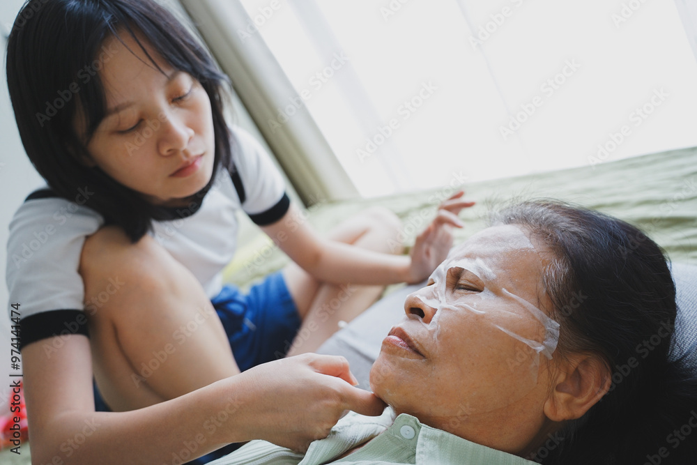 Asian woman applying mask with her mother
Asian woman applying mask with her mother