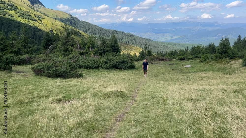 Young Hiker Walks in Carpathian Mountains Young Hiker Walks in Carpathian Mountains