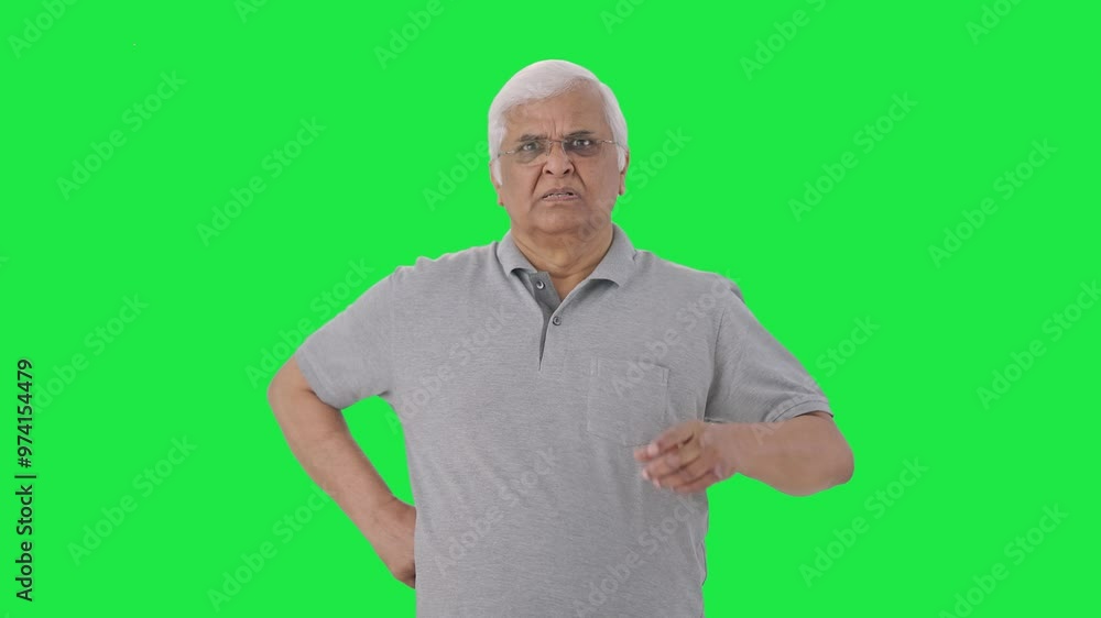 Angry Indian old man looking at the camera Green screen Angry Indian old man looking at the camera Green screen