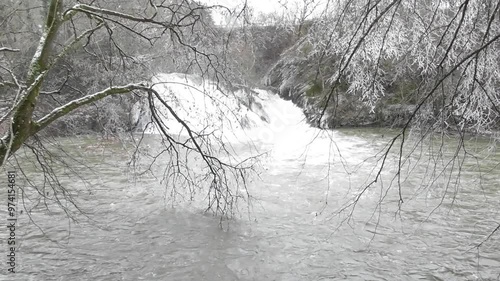 flood at the Elztalwasserfall during snow melting season, forest side photo