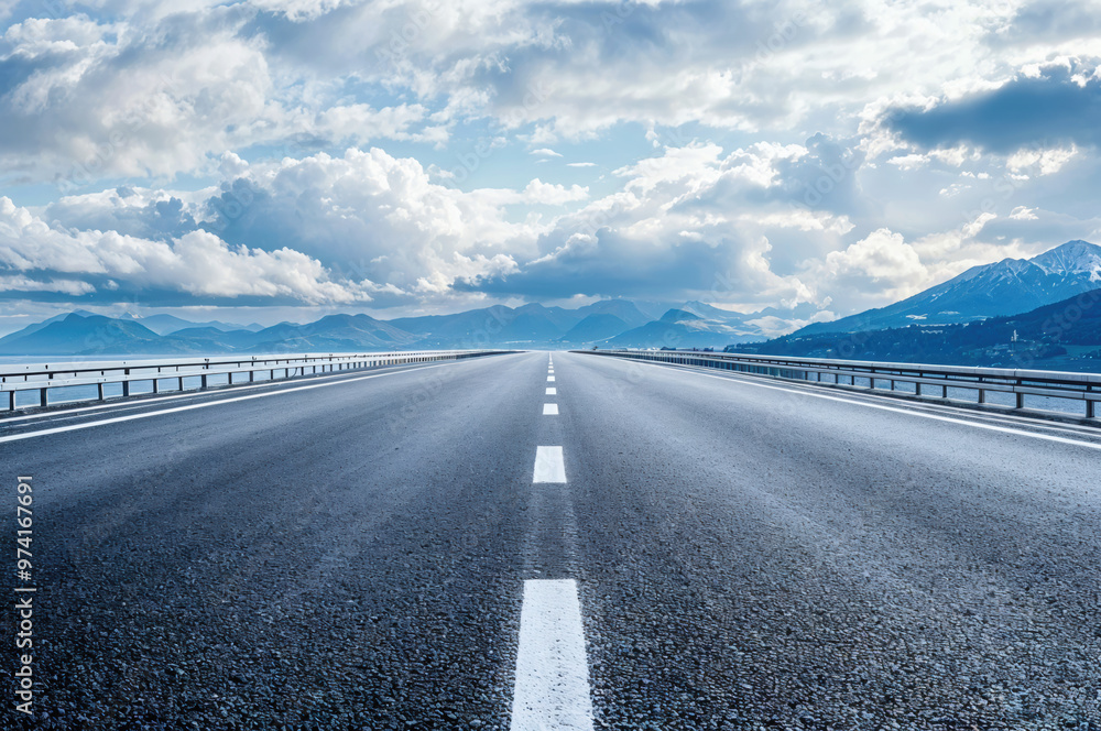 Fototapeta premium Empty asphalt highway road leading to mountains landscape