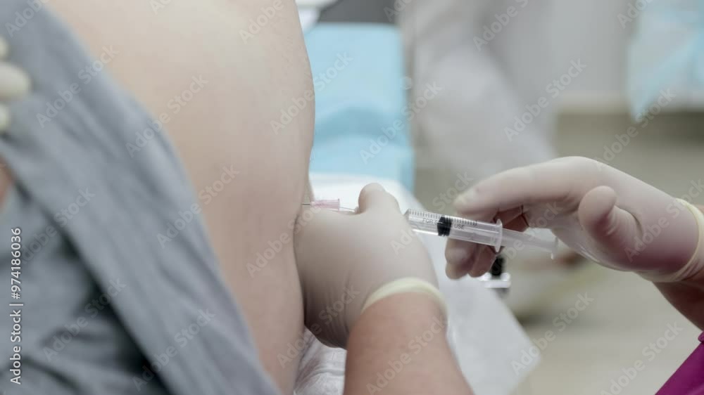 Injection of spinal anesthesia being administered as part of the ...