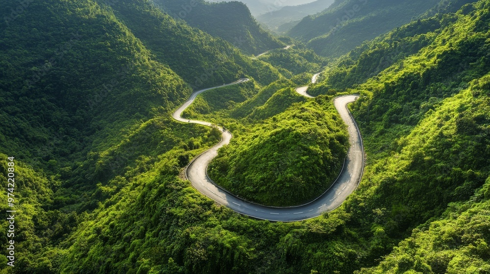 Scenic mountain pass in Vietnam, with a winding road and lush greenery Scenic mountain pass in Vietnam, with a winding road and lush greenery