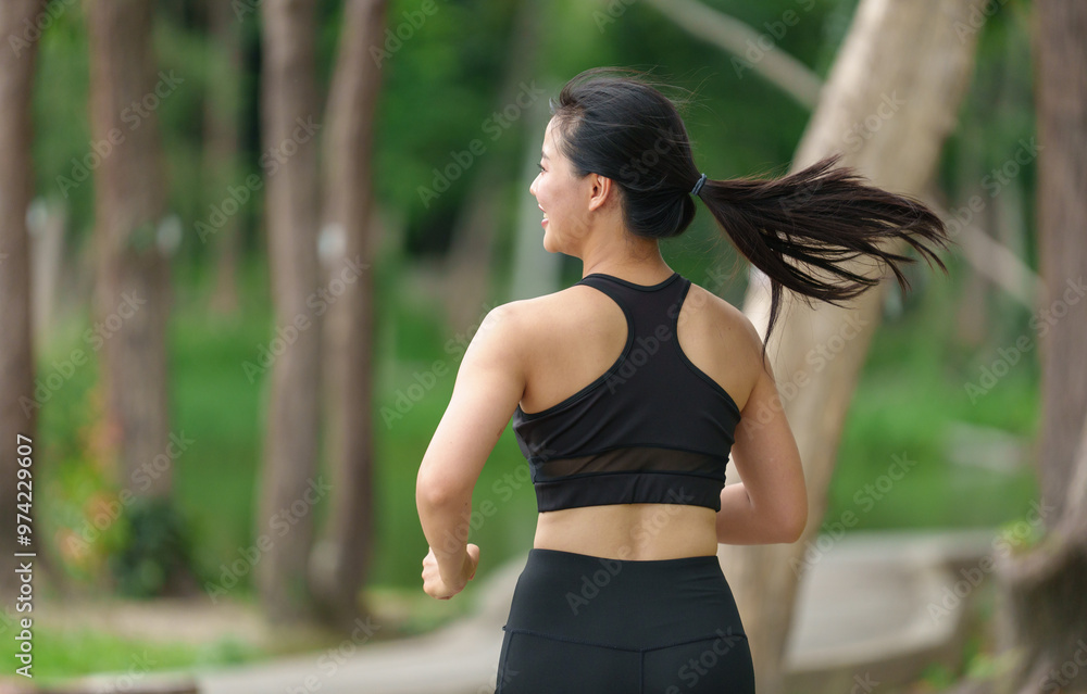 Asian woman exercising outdoors in the park. Running, stretching, relaxing, warming up. Exercise concept for good health and strength. Asian woman exercising outdoors in the park. Running, stretching, relaxing, warming up. Exercise concept for good health and strength.