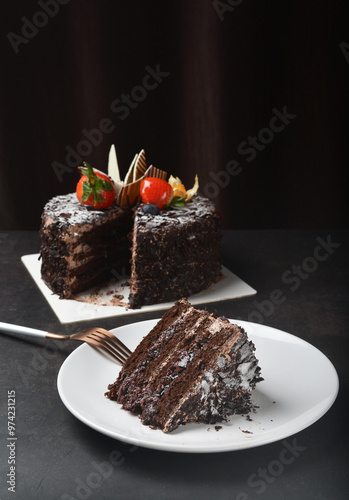 premium freshly baked dark cocoa chocolate brownie black forest blueberry jam round birthday cream cake with strawberry fruits on black table halal food sweet vegan dessert menu for pastry cafe shop