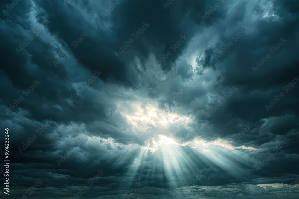 Dramatic cloud formation with piercing rays of light breaking through, creating a captivating atmospheric scene. Dramatic cloud formation with piercing rays of light breaking through, creating a captivating atmospheric scene.