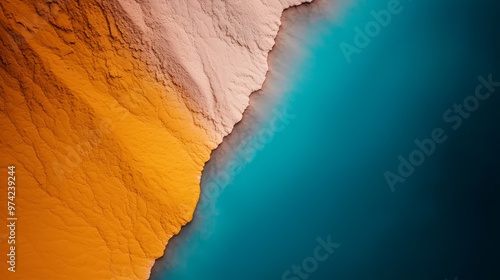  Aerial perspective of a body of water featuring a yellow-blue stripe in its midsection, plus a central blue strip