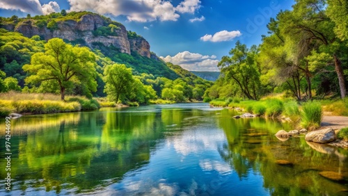 Serene Frio River winds through Garner State Park's lush green forests and scenic bluffs, offering tranquil settings