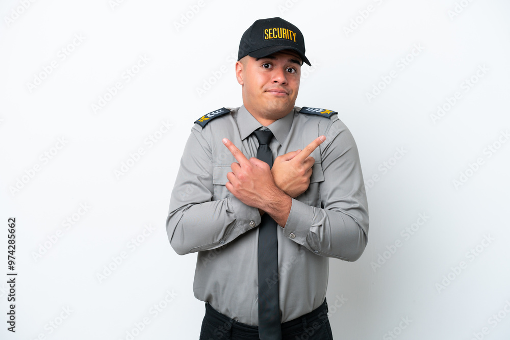 Young caucasian security man isolated on white background pointing to the laterals having doubts Young caucasian security man isolated on white background pointing to the laterals having doubts