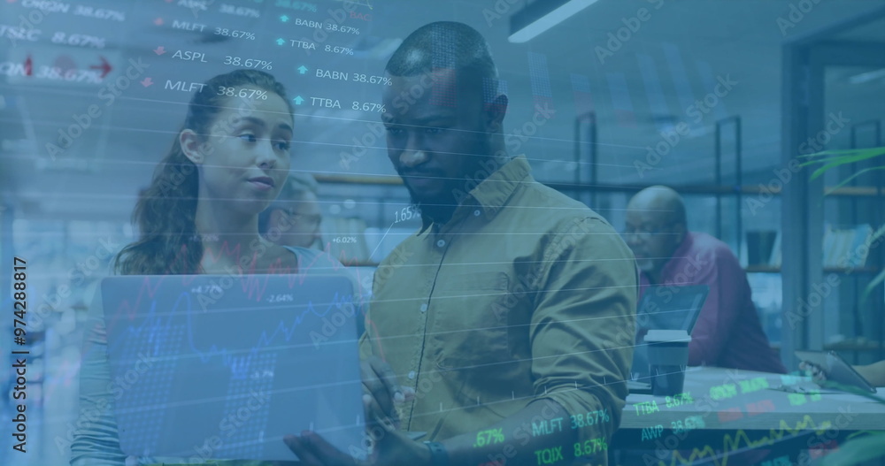 Image of financial data processing over diverse business people using laptop Image of financial data processing over diverse business people using laptop