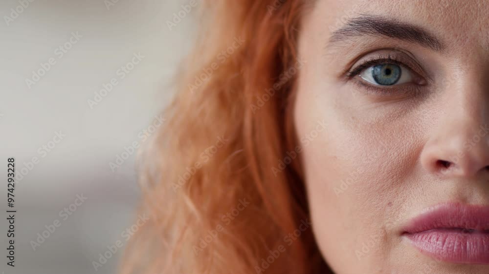 Portrait half face cropped view Caucasian redhead woman looking at camera calm serious look health medicine feminism skincare girl female eyesight human perfect skin close up indoors domestic violence Portrait half face cropped view Caucasian redhead woman looking at camera calm serious look health medicine feminism skincare girl female eyesight human perfect skin close up indoors domestic violence