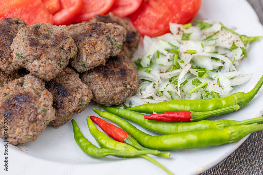 The famous Milas meatballs are made with tomatoes, onions, red and green peppers.