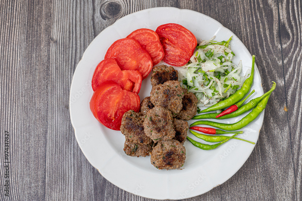The famous Milas meatballs are made with tomatoes, onions, red and green peppers.