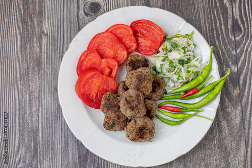 Obraz na płótnie The famous Milas meatballs are made with tomatoes, onions, red and green peppers. w salonie