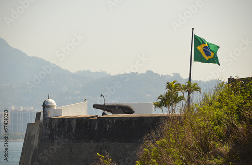 Detail of the architecture of the Santa Cruz da Barra Fortress, Brazilian flag fluttering in the wind. Santa Cruz da Barra Fortress, Niterói, Rio de Janeiro photo