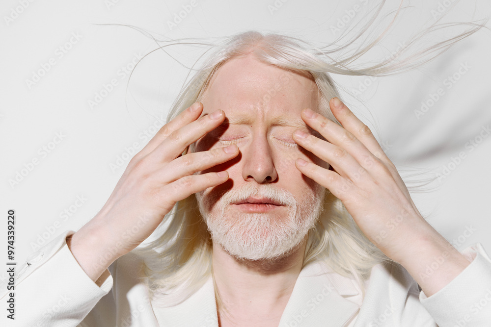 serene elderly man with long white hair, closed eyes, hands on face, minimalist white background, calm expression, beauty and aging concept, tranquility and peace serene elderly man with long white hair, closed eyes, hands on face, minimalist white background, calm expression, beauty and aging concept, tranquility and peace