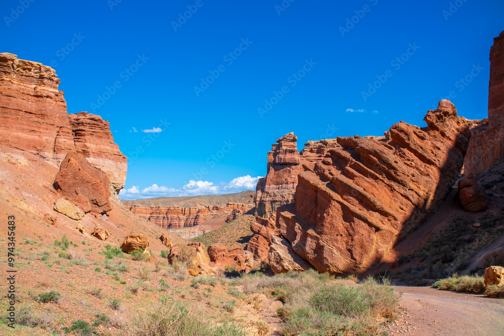 Fototapeta premium Charyn Canyon, Valley of Castles. The excellence of Kazakhstan. Panorama of natural unusual landscape. The red canyon of extraordinary beauty looks like a Martian landscape.