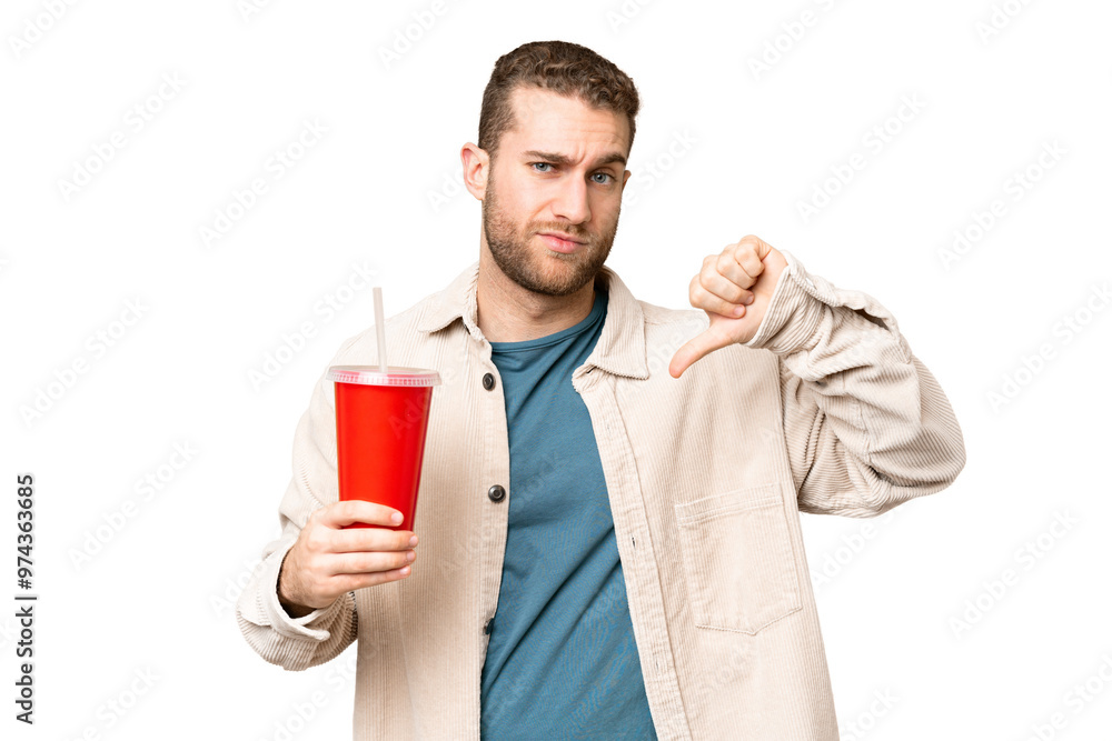 Young handsome blonde man holding soda over isolated chroma key background showing thumb down with negative expression Young handsome blonde man holding soda over isolated chroma key background showing thumb down with negative expression