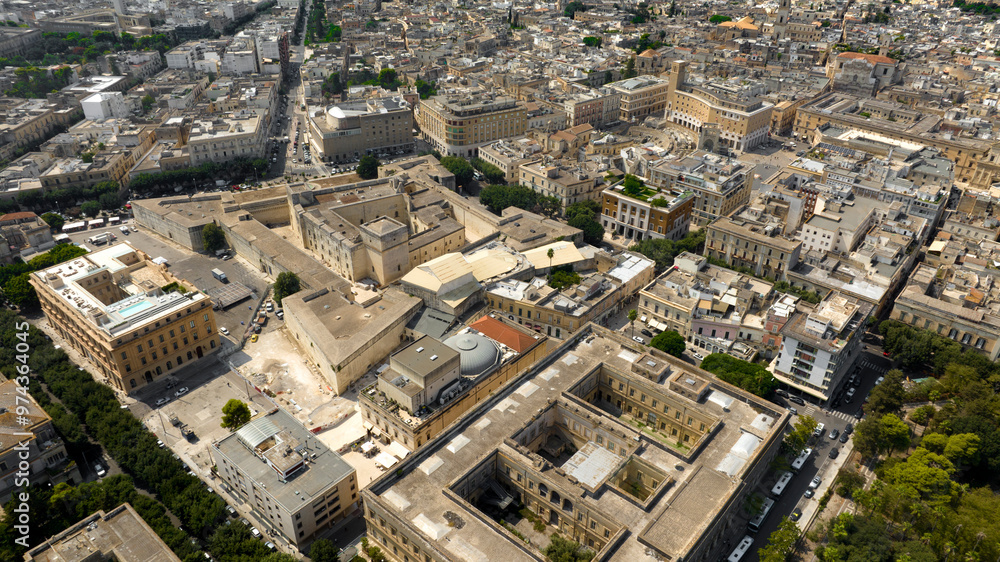Aerial view of the Castle of Charles V, also known as the Castle of Lecce, is a fortress in the historic center of Lecce, Puglia, Italy. In background is Sant'Oronzo square and the Roman amphitheater. Aerial view of the Castle of Charles V, also known as the Castle of Lecce, is a fortress in the historic center of Lecce, Puglia, Italy. In background is Sant'Oronzo square and the Roman amphitheater.
