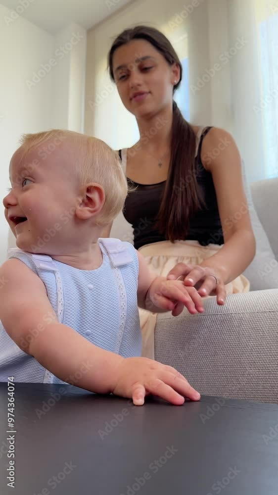 In the comforting atmosphere of their home, mother and young child share a peaceful moment together In the comforting atmosphere of their home, mother and young child share a peaceful moment together