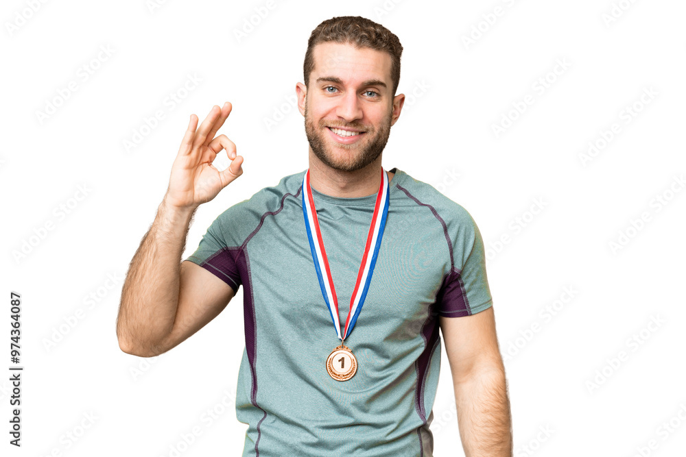 Young handsome blonde man with medals over isolated chroma key background showing ok sign with fingers Young handsome blonde man with medals over isolated chroma key background showing ok sign with fingers