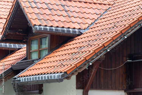 the roof of a house covered with red tiles