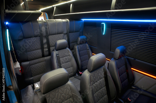 Comfortable interior of a passenger bus with soft seats. The design is made to order. Private covering of cars. Various elements of the bus interior.