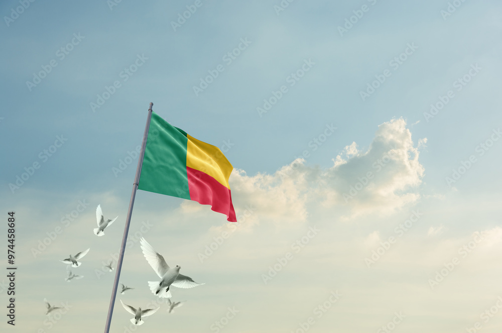 Benin flag waving with flying doves in beautiful sky. Benin flag for Republic Day and Independence Day. Benin flag waving with flying doves in beautiful sky. Benin flag for Republic Day and Independence Day.