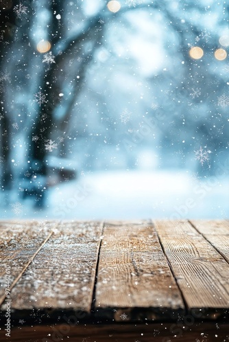 wooden empty table on a snowy winter background. Selective focus