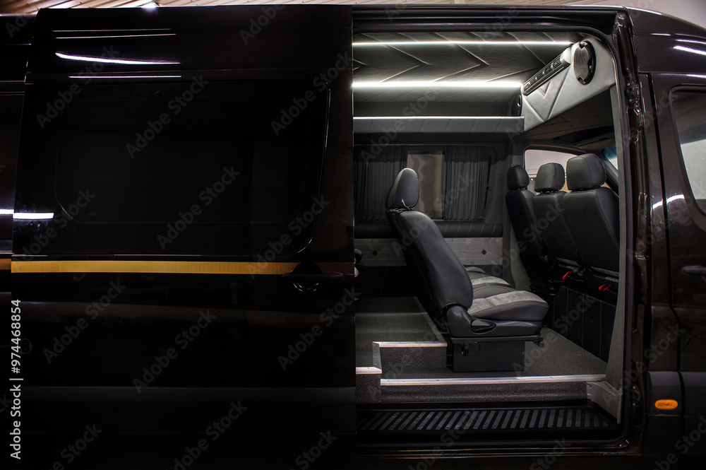 Obraz premium Comfortable interior of a passenger bus with soft seats. The design is made to order. Private covering of cars. Various elements of the bus interior.