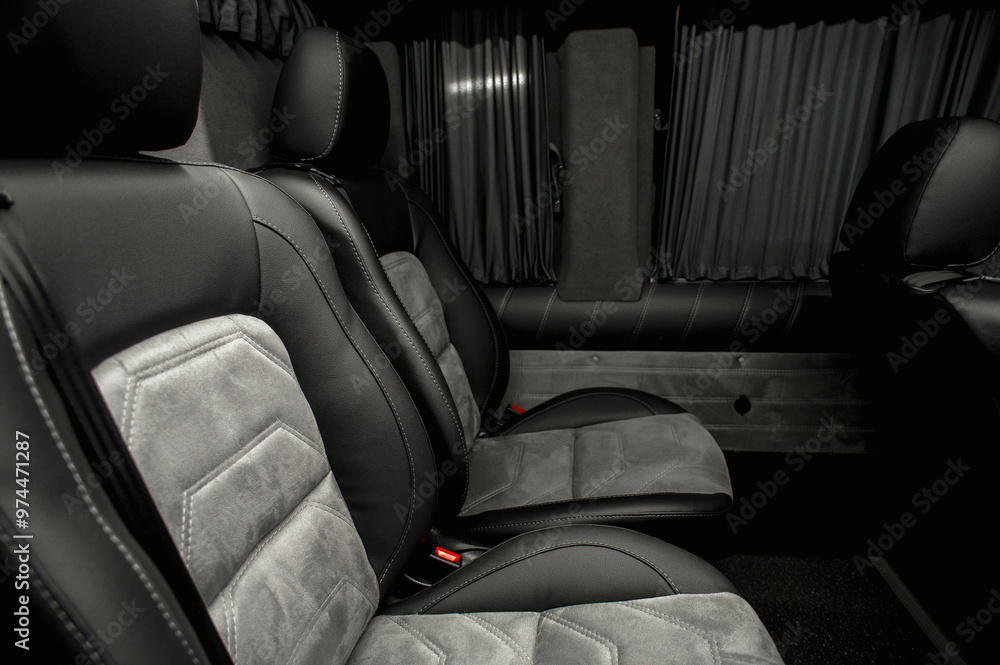 Fototapeta premium Comfortable interior of a passenger bus with soft seats. The design is made to order. Private covering of cars. Various elements of the bus interior.