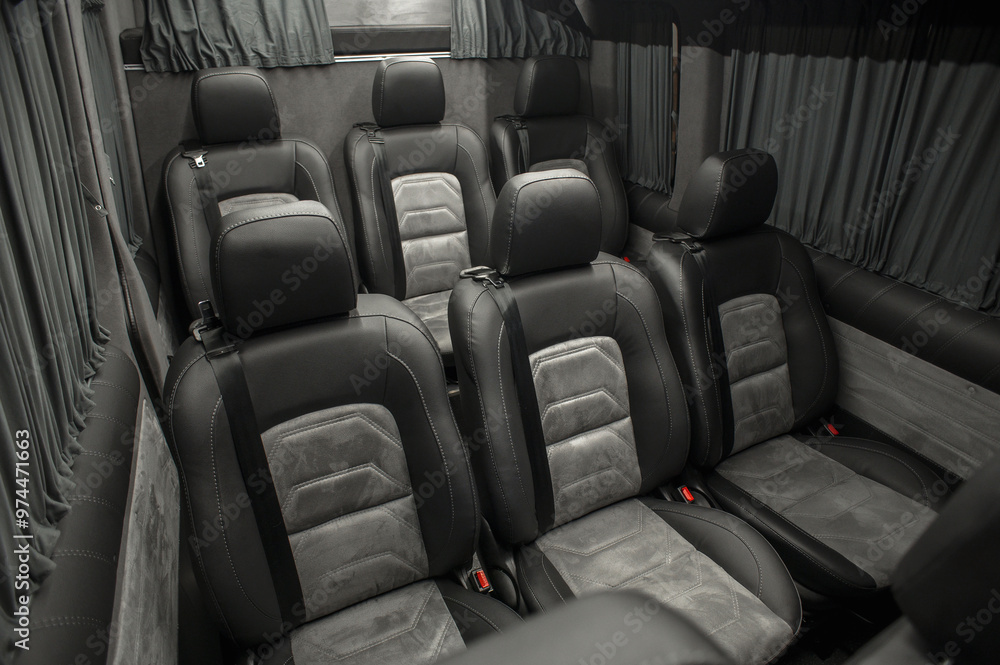 Obraz premium Comfortable interior of a passenger bus with soft seats. The design is made to order. Private covering of cars. Various elements of the bus interior.