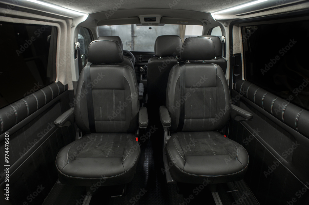 Comfortable interior of a passenger bus with soft seats. The design is made to order. Private covering of cars. Various elements of the bus interior.