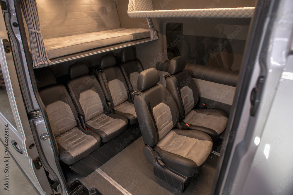 Comfortable interior of a passenger bus with soft seats. The design is ...
