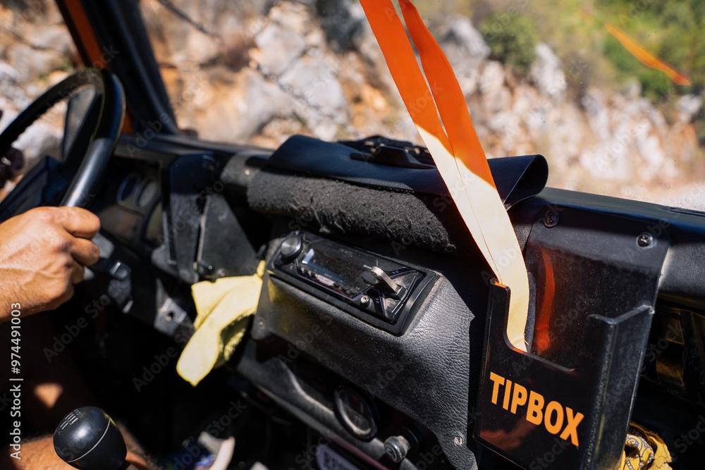 Dashboard View of an Off-road Vehicle in Antalya Region. Close-up of an off-road vehicle's dashboard with a tip box