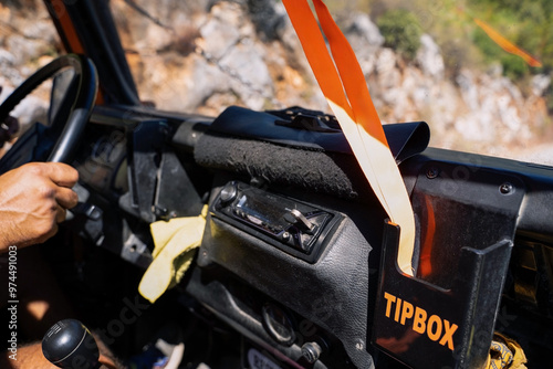 Obraz na płótnie Dashboard View of an Off-road Vehicle in Antalya Region. Close-up of an off-road vehicle's dashboard with a tip box w salonie