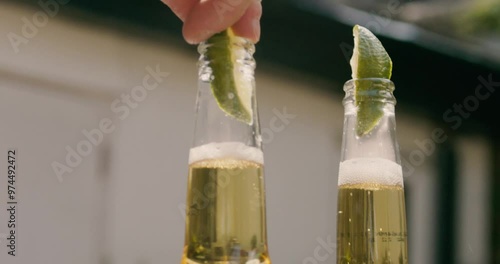 Lime Wedges into Beer Bottle