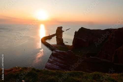 Sunset at the Rock Formation Lange Anna  at the Island  Heligoland,  Germany, Europe photo