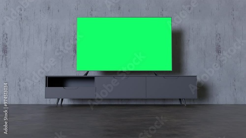 A modern living room with a large green screen TV mounted above a minimalist black TV stand against a concrete wall