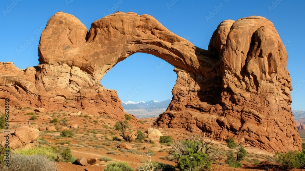 Fototapeta premium The dramatic landscape of Arches National Park, with its towering rock formations and unique arches,