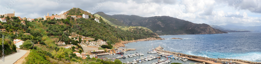 Naklejka premium Panoramic view of Cargèse, a village on the west coast of Corsica, built on a promontory facing the sea. An ancient Greek city, the village is dominated by two churches, one Latin, the other Orthodox