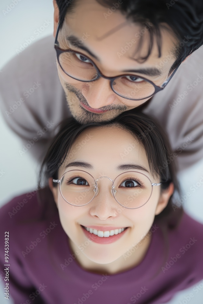 a couple dressed in matching purple on a white background with above view shot. Their posture symbolize unity, harmony, making it a heartwarming depiction of a lasting relationship. a couple dressed in matching purple on a white background with above view shot. Their posture symbolize unity, harmony, making it a heartwarming depiction of a lasting relationship.