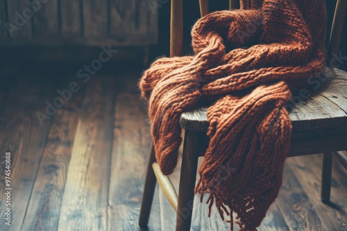 Cozy Knitted Scarf Draped on Wooden Chair photo