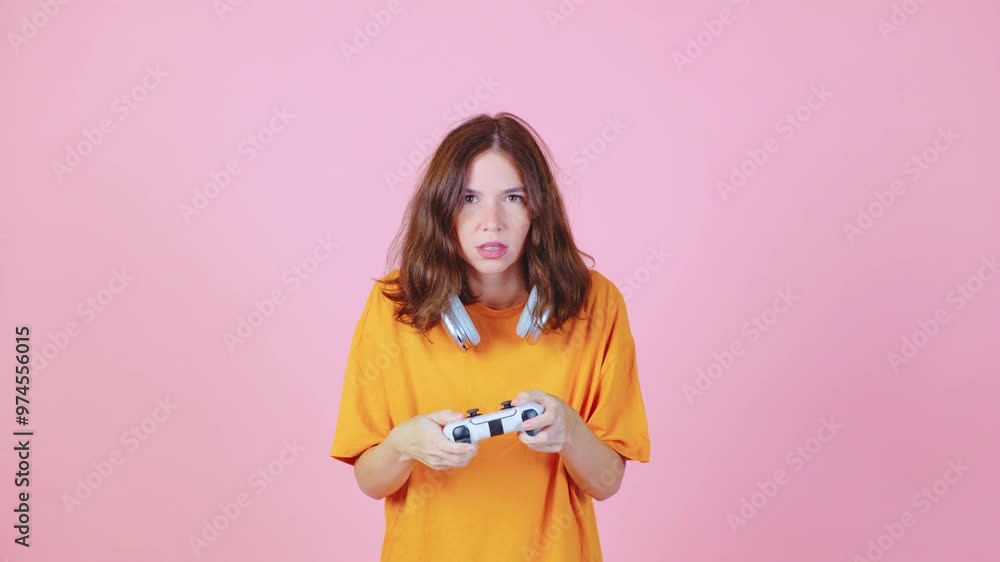 A young gamer is immersed in gameplay, showcasing skillful maneuvers on the controller against a vibrant pink background, creating an energetic and engaging visual experience A young gamer is immersed in gameplay, showcasing skillful maneuvers on the controller against a vibrant pink background, creating an energetic and engaging visual experience