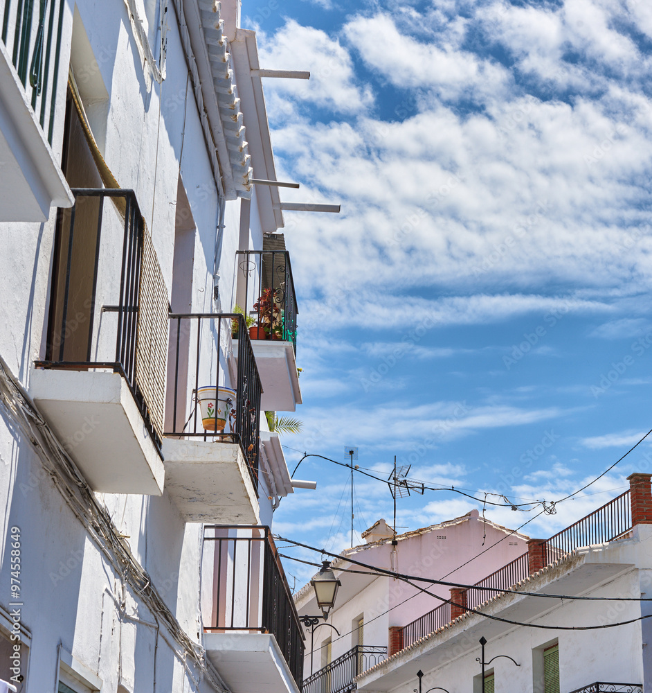 History, sky and balcony on house for architecture, buildings and travel in Spain. Frigiliana, wallpaper and village design with heritage for exploration, culture or whitewash in Europe for aesthetic