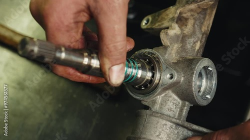 Worker mechanic apply dense grease lubricant to a steering rack and repair process of steering rack