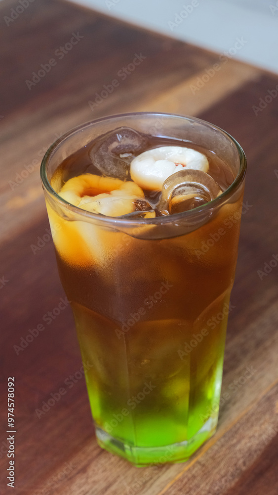 A glass of lychee ice tea A glass of lychee ice tea