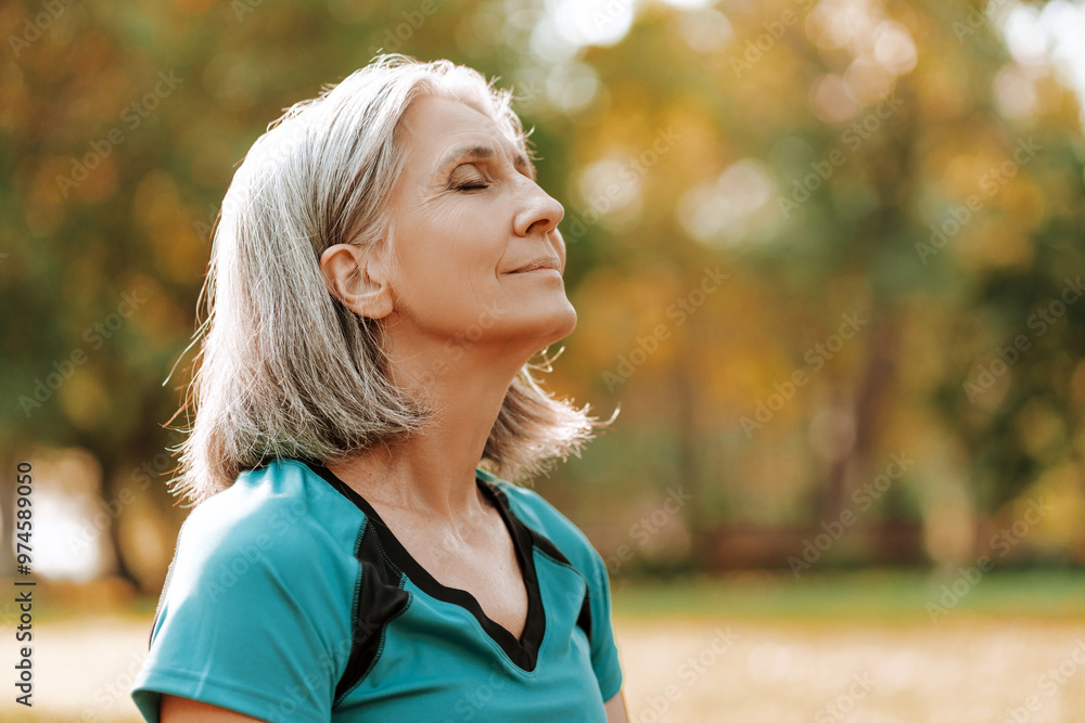 © Maria Vitkovska - Beautiful senior woman breathing fresh air in park, closeup outdoors, copy space © Maria Vitkovska - Beautiful senior woman breathing fresh air in park, closeup outdoors, copy space