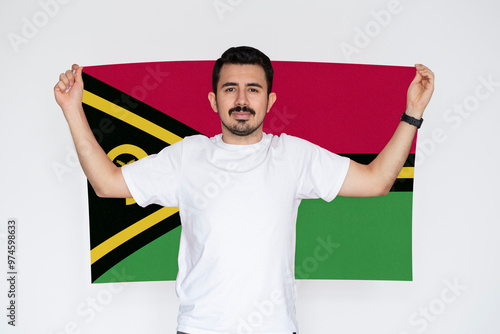 Moustached man holding Vanuatu flag, campaigning concept, patriot and nationalist person