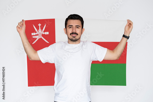 Фотография Moustached man holding Oman flag, patriot and nationalist person, independence o